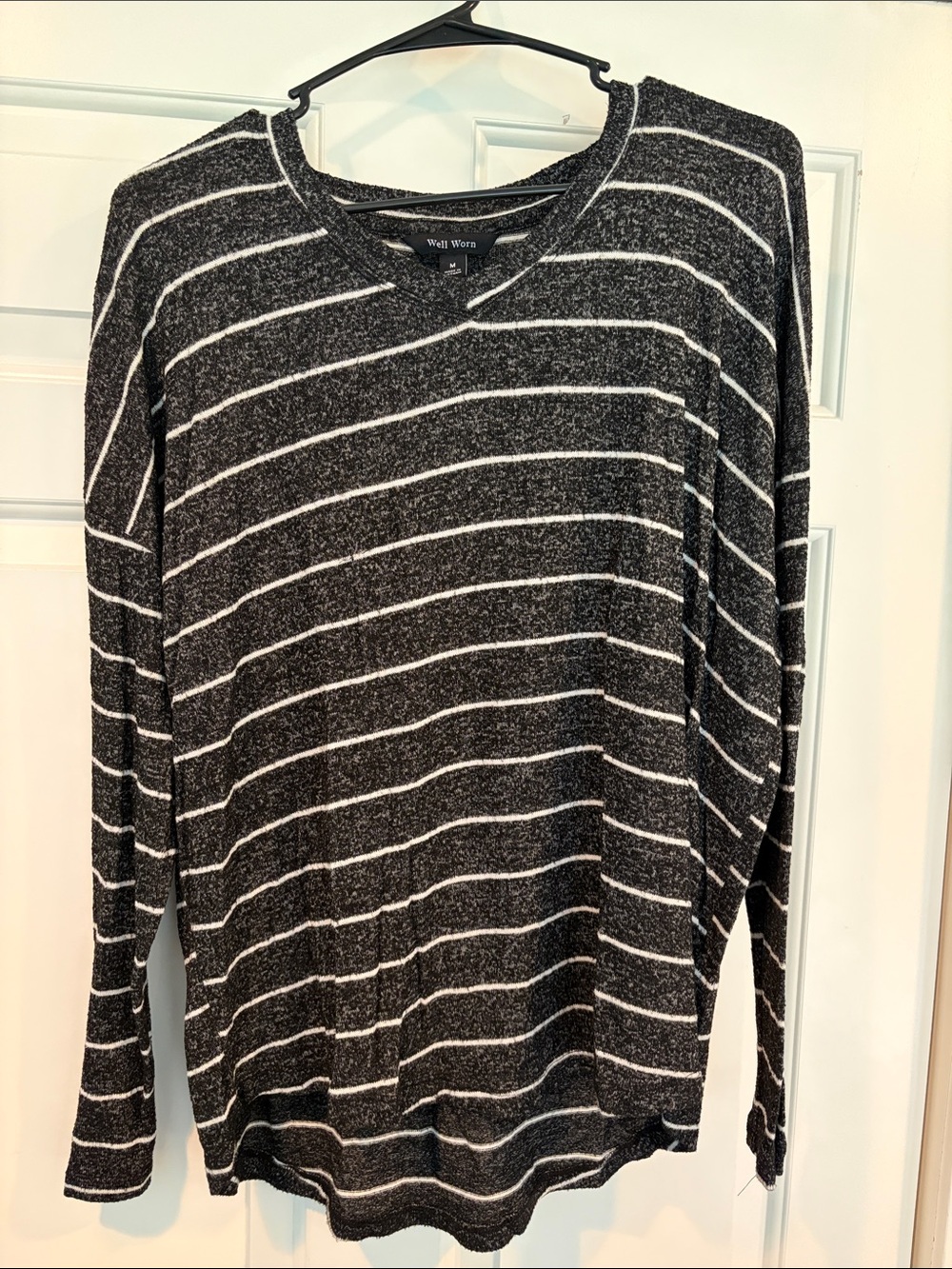 Well Worn Woman’s Black & White Striped V-Neck Sweater
